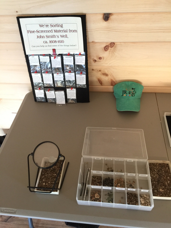 Aronowitz has setup a sorting station where guests get to be the first to sift through dirt from James Fort and pluck out small artifacts. (Gregory Connolly/WYDaily)