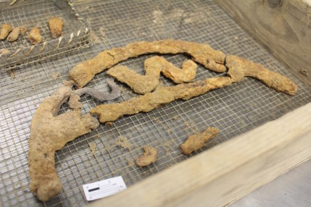 A piece of an iron grill found during the excavation of a cellar at Historic Jamestowne. (Elizabeth Hornsby/WYDaily)