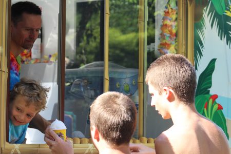 Jamie and Jacob Meyerhoeffer serving customers shaved ice. . (Andrew Harris/WYDaily.)