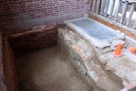 Preservation Virginia dug a pit in the chancel where APVA dug more than a century ago. To the right of the frame is the Knight's Tomb, which archaeologists say likely marked the burial of a high-status colonist. (Andrew Harris/WYDaily)