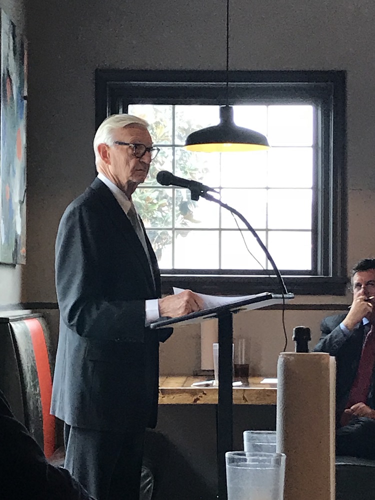 Taylor Reveley address a packed Old City Barbeque. (Bonny Markwith/Local Voice Media)