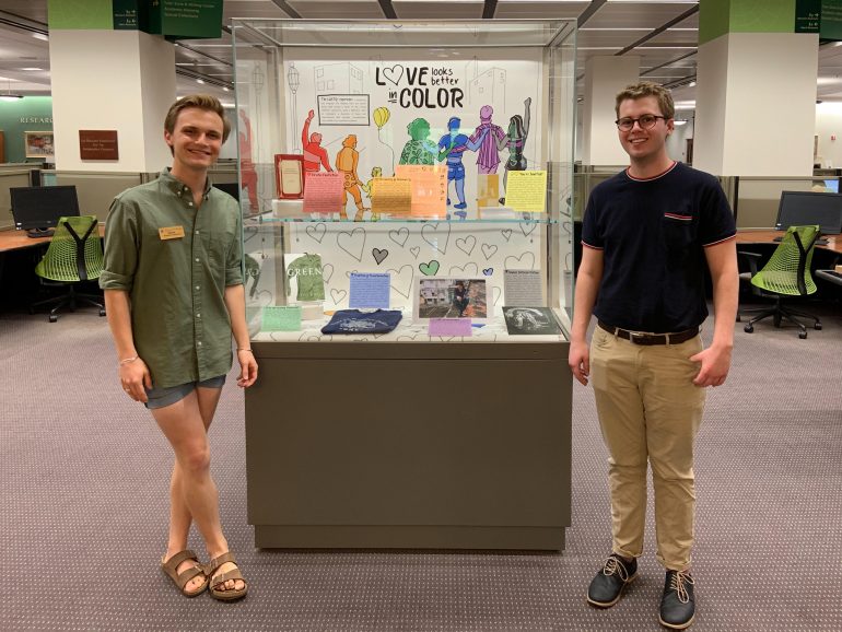 Abram Clear, special collections student graphics assistant (left), and Jacob Hopkins, a William & Mary Libraries Mosaic Fellow worked together to create the “Love Looks Better in Color” exhibit at Swem Library. (WYDaily/Courtesy Jacob Hopkins)