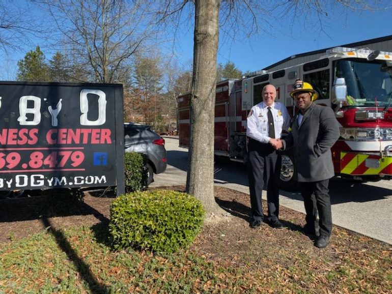 Steve Kopczynski, fire chief for York County Department of Fire and Life Safety, with L. D'Shawn Wright, owner of Body by D Gym and Fitness Center. (WYDaily/Courtesy York County Department of Fire and Life Safety)