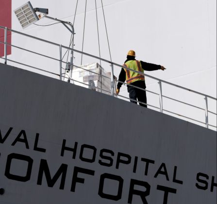 Supplies and personnel are loaded aboard the Military Sealift Command hospital ship USNS Comfort (T-AH 20) at Naval Station Norfolk, March 24, 2020. (Petty Officer 1st Class Joshua Sheppard)