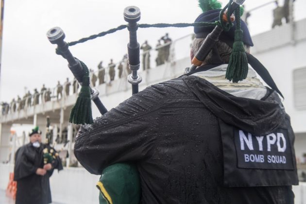 New York Police Department Pipes and Drums band play for the crew of the hospital ship USNS Comfort (T-AH 20) before they depart New York Harbor after treating patients in New York and New Jersey. The ship and its embarked medical task force remain prepared for future tasking. The Navy, along with other U.S. Northern Command dedicated forces, remains engaged throughout the nation in support of the broader COVID-19 response.(U.S. Navy photo by Mass Communication Specialist 3rd Class Keia Randall/Released)